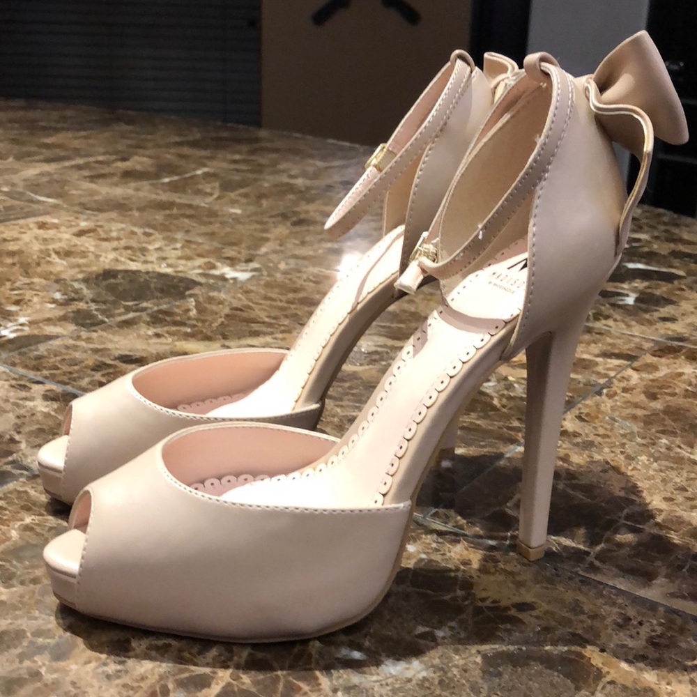 Madison “Sharla” Bow Heel Ankle Strap Heels.